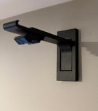 Black wall-mounted bracket on a light gray wall .track for curtains, livingroom, bedroom ,dininroom, patio door