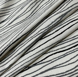 Woven 100% cotton light fabric featuring narrow gray and black stripes.