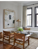Living room with linen curtain in natural color and white couch