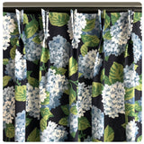 Pinch pleated floral drapes with navy background and light blue Gortenzia flowers