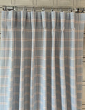 Custom light blue plaid drapes with beige details made in Canada for elegant window treatments.