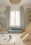 Modern children's room with a gray sofa, wooden slide, and decorative elements.Light blue curtains 
