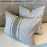 Elegant neutral decorative lumbar pillow in pure washed linen with embroidered center trim