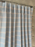 Light blue textured plaid custom drapes with beige windowpane lines made in Canada for elegant window treatments.